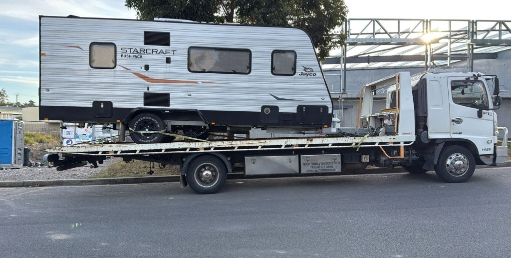 Professional caravan towing service transporting caravans safely.